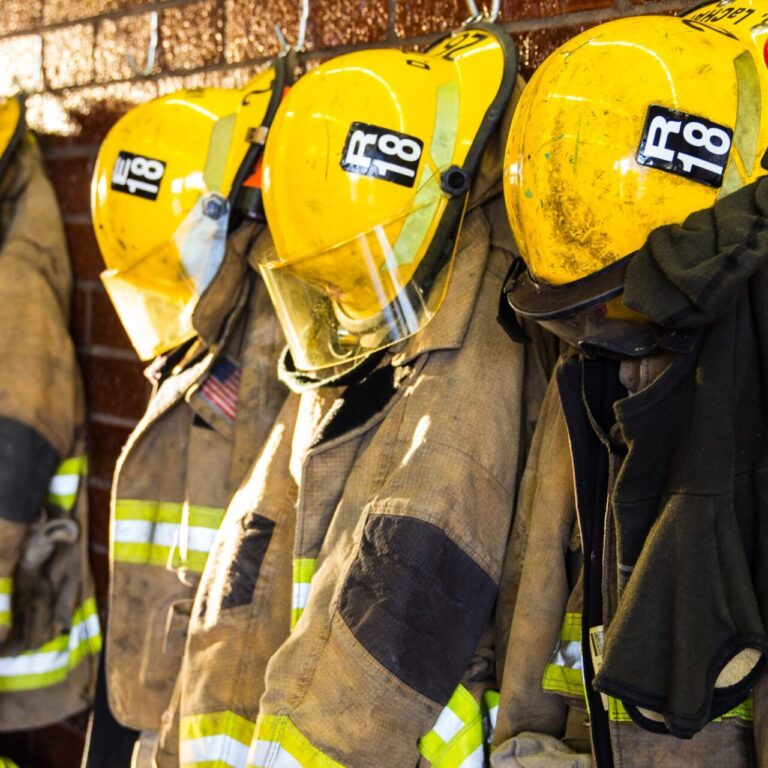 Firefighter gear hanging side by side